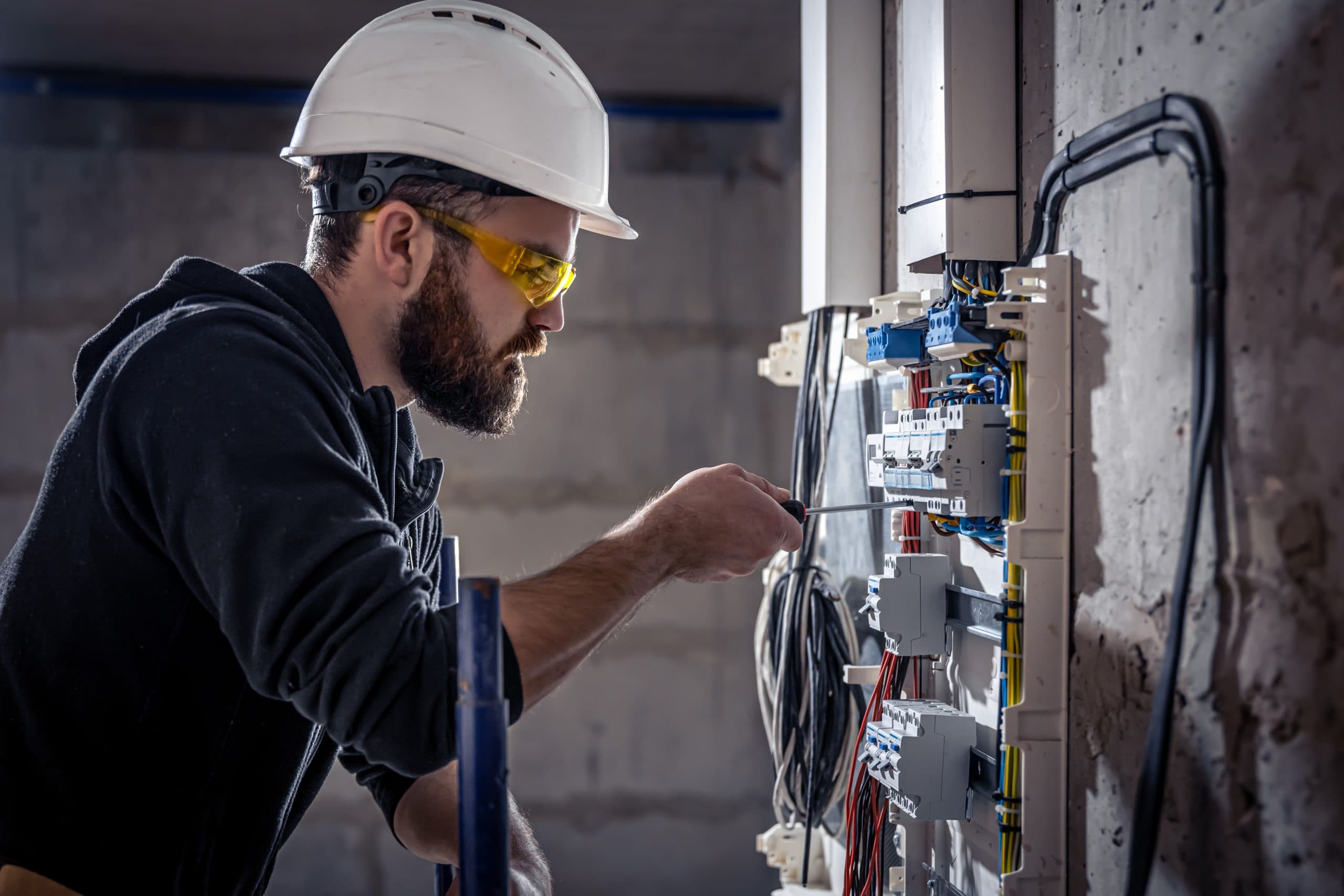 Electrician working on a panel